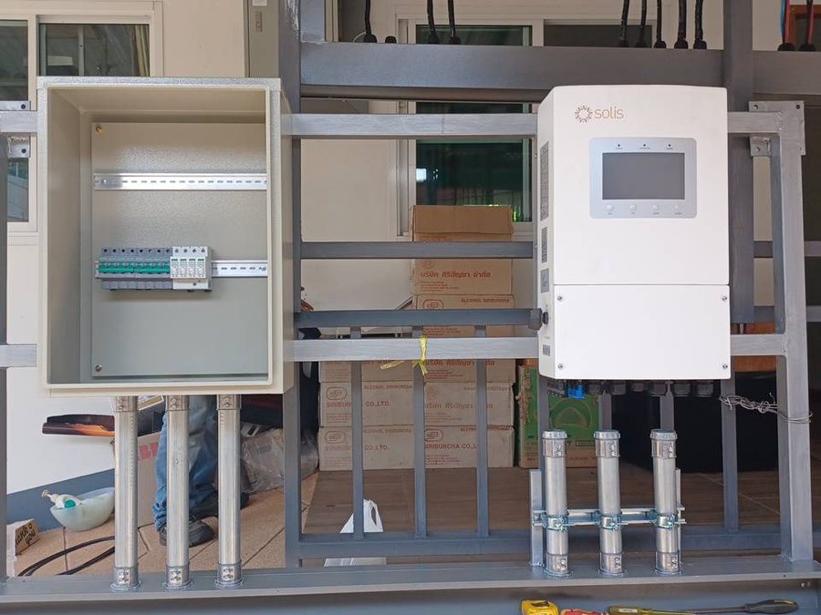 Inverter and AC/DC combiner box on a steel mounting frame with conduit
