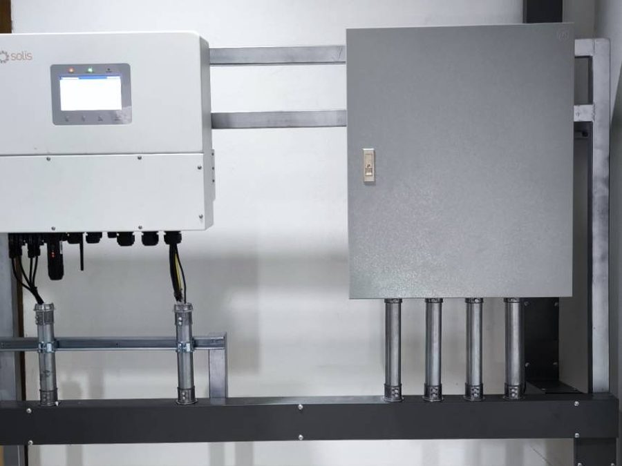 Inverter and distribution box installed indoors above a wireway